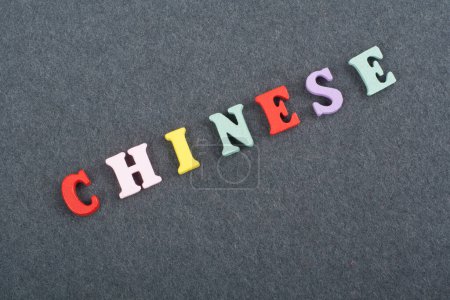 Photo for CHINESE word on black board background composed from colorful abc alphabet block wooden letters, copy space for ad text. Learning english concept - Royalty Free Image