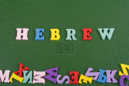 Photo for HEBREW word on green background composed from colorful abc alphabet block wooden letters, copy space for ad text. Learning english concept - Royalty Free Image