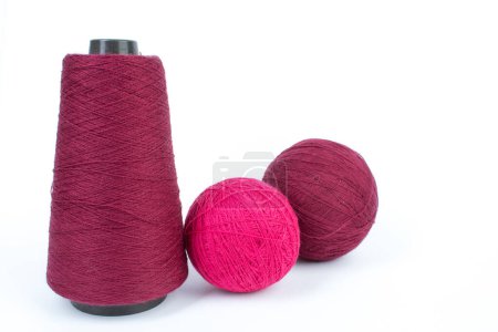 Foto de Knitting yarn for knitting on white background. red - Imagen libre de derechos