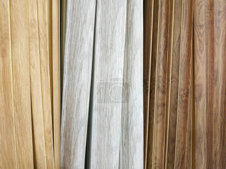 Photo for Artistic wooden background from different types of wood. Copy space for text - Royalty Free Image