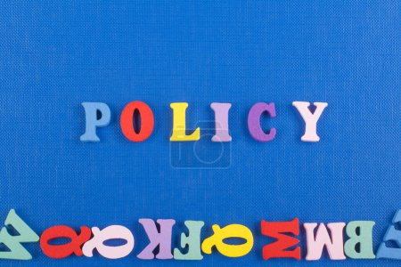 Photo for POLICY word on blue background composed from colorful abc alphabet block wooden letters, copy space for ad text. Learning english concept - Royalty Free Image