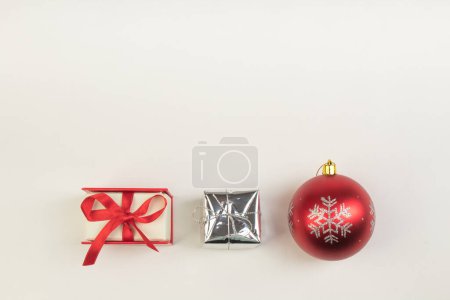 Photo for Colorful wrapped gift boxes, Christmas toys on isolated background. Beautiful present box with overwhelming bow. Christmas surprise icon. Happy new year decor, discounts, promotions. - Royalty Free Image