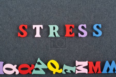 Photo for STRESS word on black board background composed from colorful abc alphabet block wooden letters, copy space for ad text. Learning english concept - Royalty Free Image