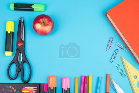 Photo for Back to school. Stationery on a blue table. Office desk with copy space. Flat lay - Royalty Free Image