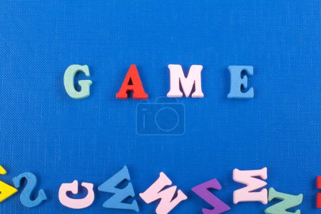 Photo for GAME word on blue background composed from colorful abc alphabet block wooden letters, copy space for ad text. Learning english concept - Royalty Free Image