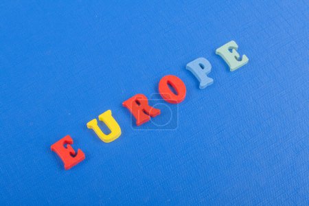 Photo for EUROPE word on blue background composed from colorful abc alphabet block wooden letters, copy space for ad text. Learning english concept - Royalty Free Image