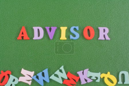 Photo for ADVISOR word on green background composed from colorful abc alphabet block wooden letters, copy space for ad text. Learning english concept - Royalty Free Image