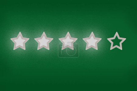Photo for Gray, silver five star shape on a green background. The best excellent business services rating customer experience concept. Increase rating or ranking, evaluation and classification idea - Royalty Free Image