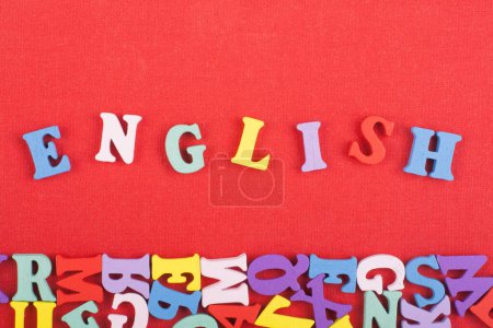 Photo for English word on red background composed from colorful abc alphabet block wooden letters, copy space for ad text. Learning english concept - Royalty Free Image
