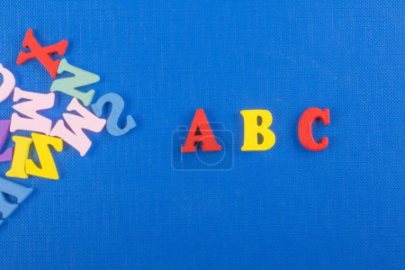 Photo for Word on blue background composed from colorful abc alphabet block wooden letters, copy space for ad text. Learning english concept - Royalty Free Image