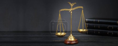 Photo for Law concept - Open law book with a wooden judges gavel on table in a courtroom or law enforcement office on blue background. Copy space for text, Banner - Royalty Free Image