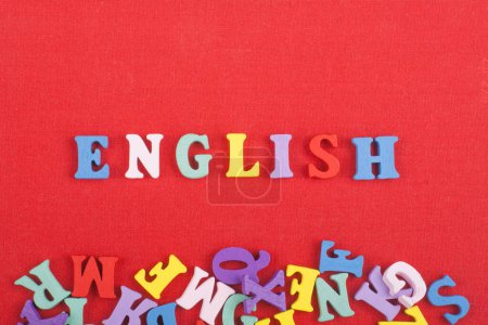 Photo for English word on red background composed from colorful abc alphabet block wooden letters, copy space for ad text. Learning english concept - Royalty Free Image