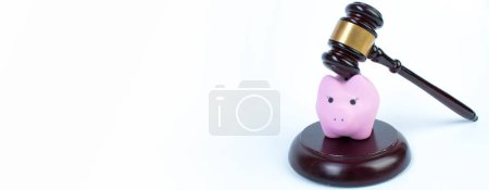 Photo for Pink piggy bank, Judge's gavel on a white background. savings concept, fundraising. Law concept. Legal and illegal means, income, savings - Royalty Free Image