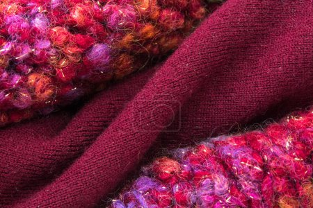 Photo for Knitted woolen sweaters. A bunch of knitted winter, autumn clothes, sweaters, knitwear, space for the text - Royalty Free Image