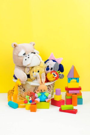 Photo for Collection of colorful toys on yellow background - Royalty Free Image