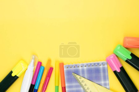 Photo for Back to school. Stationery on a yellow table. Office desk with copy space. Flat lay - Royalty Free Image