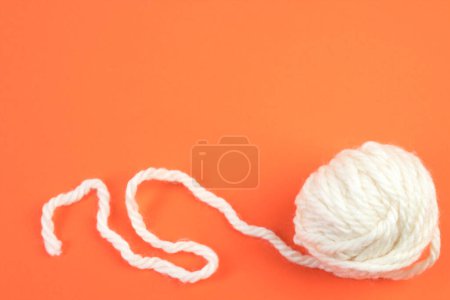 Photo for Knitting yarn for knitting on orange background. white - Royalty Free Image