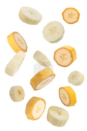 Foto de Frutas voladoras. Fruta de plátano en rodajas que cae aislada sobre fondo blanco con ruta de recorte como elemento de diseño del paquete - Imagen libre de derechos
