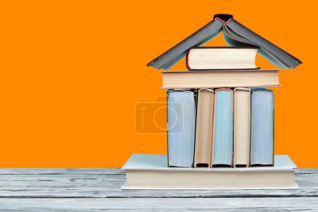 Photo for Open book, hardback colorful books on wooden table. Back to school. Copy space for text. Education business concept - Royalty Free Image
