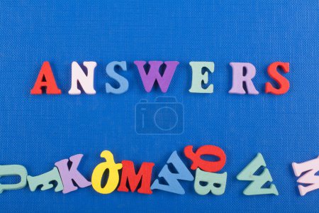 Photo for ANSWERS word on blue background composed from colorful abc alphabet block wooden letters, copy space for ad text. Learning english concept - Royalty Free Image