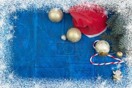 Photo for Santa red hat, Gift boxes and colorful present for christmas on blue background. Top view with copy space. - Royalty Free Image
