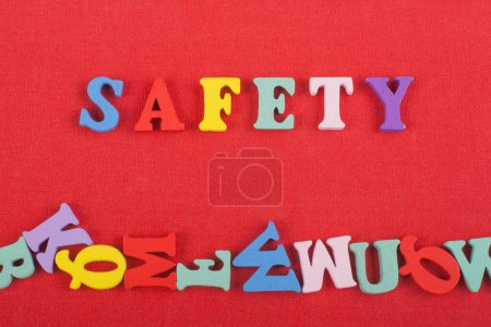 Photo for SAFETY word on red background composed from colorful abc alphabet block wooden letters, copy space for ad text. Learning english concept - Royalty Free Image