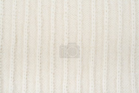 Pullover oder Schal Stoff Textur große Strickwaren. Gestrickter Jersey Hintergrund mit Reliefmuster. Handarbeit aus Wolle, handgemacht