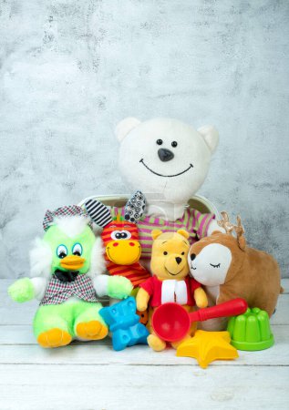 Photo for Collection of colorful toys on gray concrete background. Kids toys - Royalty Free Image