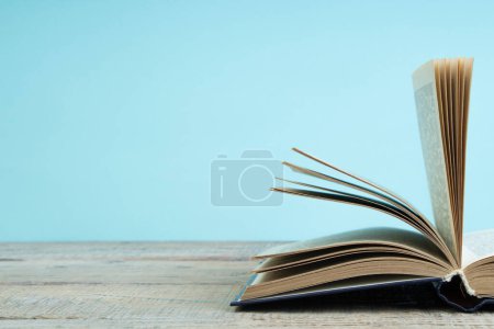 Photo for Open book on a wooden table. Back to school. Education business concept - Royalty Free Image