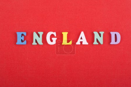 Photo for ENGLAND word on red background composed from colorful abc alphabet block wooden letters, copy space for ad text. Learning english concept - Royalty Free Image