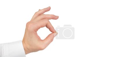 Photo for Female hand showing OK sign. Isolated on white background. Banner - Royalty Free Image