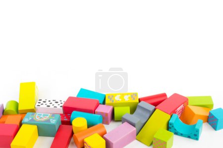 Photo for Top view of colorful wooden bricks on the table. Early learning. Educational toys on a white background. For the development of the child. - Royalty Free Image