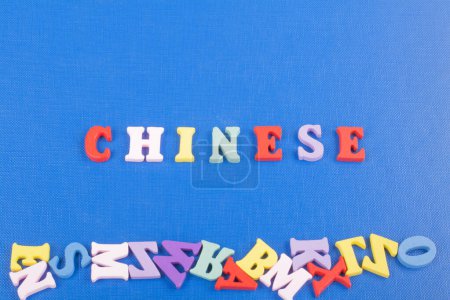 Photo for CHINESE word on blue background composed from colorful abc alphabet block wooden letters, copy space for ad text. Learning english concept - Royalty Free Image
