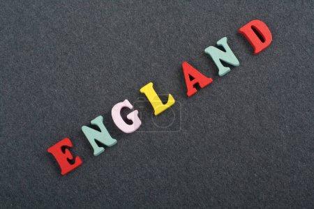 Photo for ENGLAND word on black board background composed from colorful abc alphabet block wooden letters, copy space for ad text. Learning english concept - Royalty Free Image