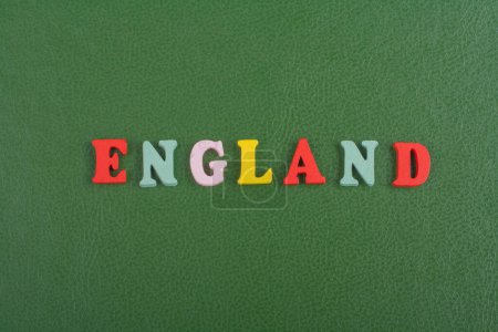 Photo for ENGLAND word on green background composed from colorful abc alphabet block wooden letters, copy space for ad text. Learning english concept - Royalty Free Image