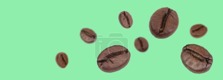 Photo for Falling coffee beans isolated on background. Flying defocused coffee beans. Used for cafe advertising, packaging, menu design. Banner - Royalty Free Image