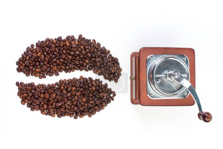 Photo for A pile of coffee beans on a white background in the shape of a cup and saucer. Top view - Royalty Free Image