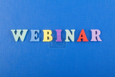 Photo for WEBINAR word on blue background composed from colorful abc alphabet block wooden letters, copy space for ad text. Learning english concept - Royalty Free Image