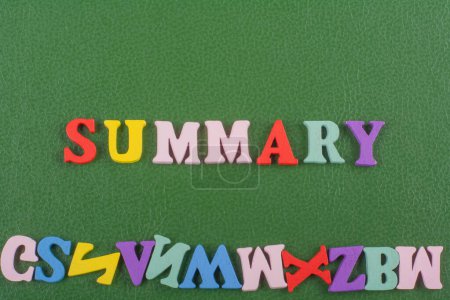 SUMMARY word on green background composed from colorful abc alphabet block wooden letters, copy space for ad text. Learning english concept
