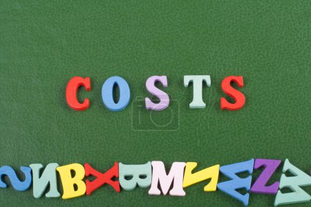 Photo for Costs word on green background composed from colorful abc alphabet block wooden letters, copy space for ad text. Learning english concept - Royalty Free Image