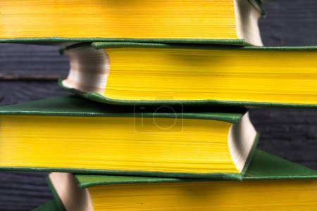 Photo for Books on wooden table, black board background. Back to school. Education business concept - Royalty Free Image