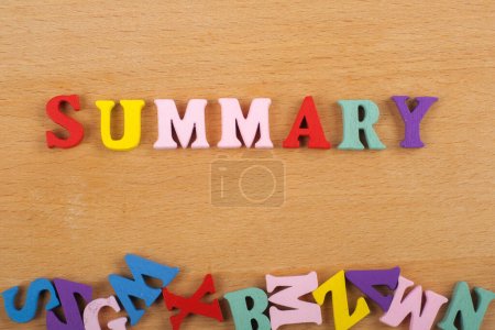 SUMMARY word on wooden background composed from colorful abc alphabet block wooden letters, copy space for ad text. Learning english concept