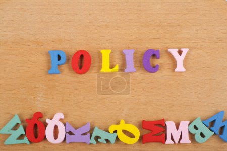Photo for POLICY word on wooden background composed from colorful abc alphabet block wooden letters, copy space for ad text. Learning english concept - Royalty Free Image