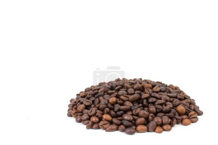 Photo for Pile of coffee beans in the center of a white table. Front view. Horizontal composition - Royalty Free Image