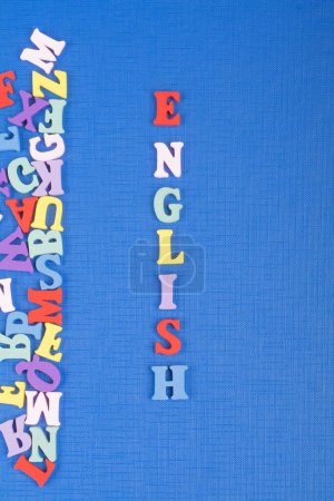 Photo for English word on blue background composed from colorful abc alphabet block wooden letters, copy space for ad text. Learning english concept - Royalty Free Image