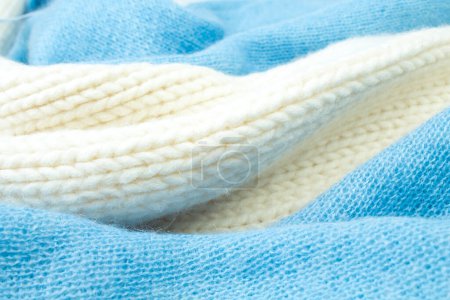 Photo for Knitted woolen sweaters. A bunch of knitted winter, autumn clothes, sweaters, knitwear, space for the text - Royalty Free Image