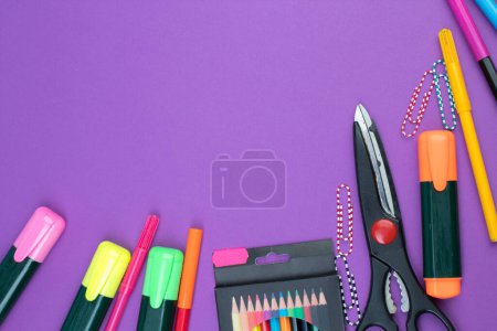 Photo for Back to school. Stationery on a Purple table. Office desk with copy space. Flat lay - Royalty Free Image