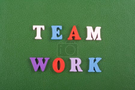Photo for TEAM WORK word on green background composed from colorful abc alphabet block wooden letters, copy space for ad text. Learning english concept - Royalty Free Image