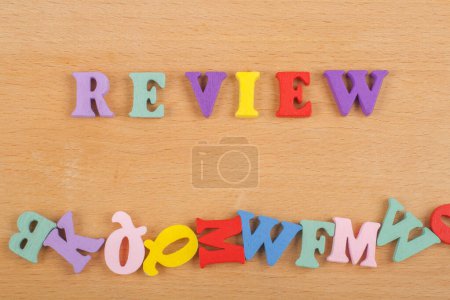 Photo for REVENUE word on wooden background composed from colorful abc alphabet block wooden letters, copy space for ad text. Learning english concept - Royalty Free Image