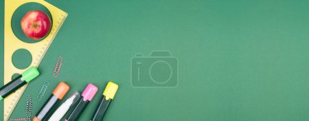 Photo for Back to school. Stationery on a green table. Office desk with copy space. Flat lay. Banner - Royalty Free Image